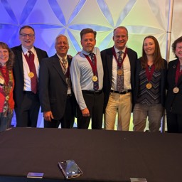 Photo of 2025 Induction: L-->R Karen Agee, Russ Hodges, Jack Truschel, Michael Frizell, Geoff Bailey, Jodi Lampi, Patricia Mulcahy-Ernt