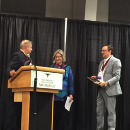 Council Chair Jack Truschel introducing Fellows Inductee Jacqueline Harris with Fellow Russell Hodges 
